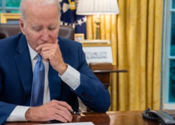 President Joe Biden talks on the phone with Canadian Prime Minister Justin Trudeau in the Oval Office of the White House, Wednesday, June 7, 2023, to talk about the Canadian wild fires and the smoke blanketing parts of the U.S. (Official White House Photo by Adam Schultz)