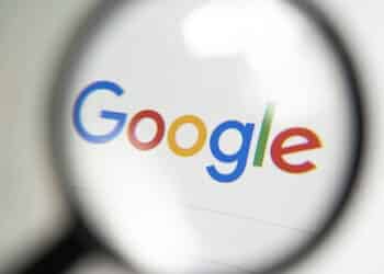 Barnaul. Russia June 20, 2022: Google search logo on screen through a magnifying glass