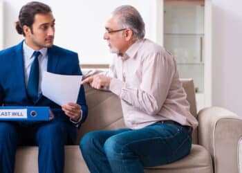 Young lawyer visiting old man in testament concept