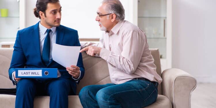 Young lawyer visiting old man in testament concept