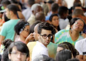 salvador, bahia, brazil - october 7, 2018: People are seen queuing at a polling station during election in the city of Salvador. *** Local Caption *** .