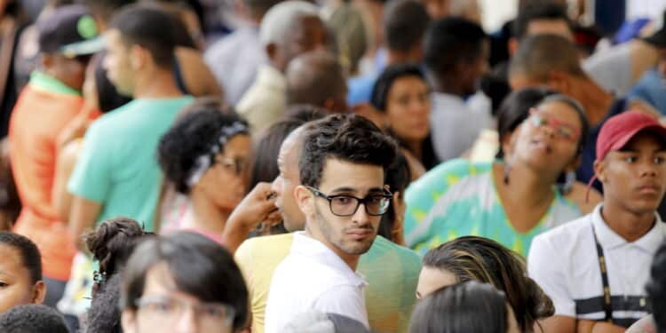 salvador, bahia, brazil - october 7, 2018: People are seen queuing at a polling station during election in the city of Salvador. *** Local Caption *** .