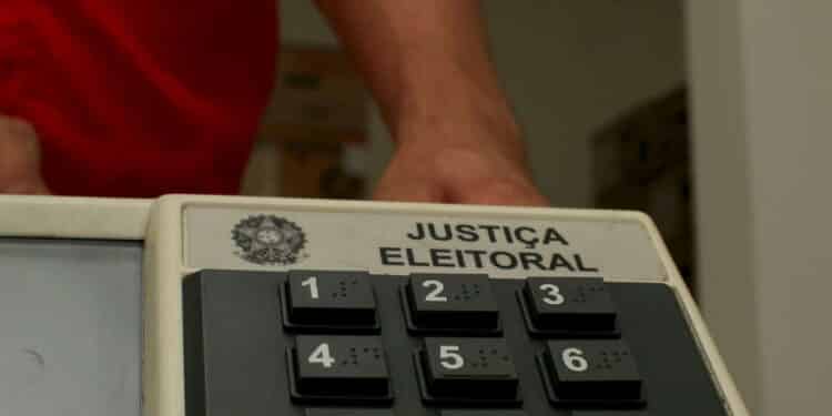 eunapolis, bahia / brazil - september 29, 2008: employee of the Regional Electoral Court repairs a Brazilian electronic ballot box for elections in the city of Eunapolis.


 *** Local Caption *** .