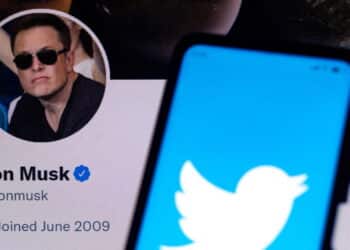 April 11, 2022, Brazil. In this photo illustration the Twitter logo seen displayed on a smartphone with the Elon Musk's official Twitter profile