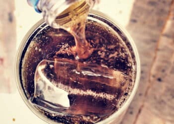 Glass of cola with ice cubes