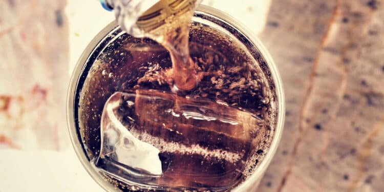 Glass of cola with ice cubes