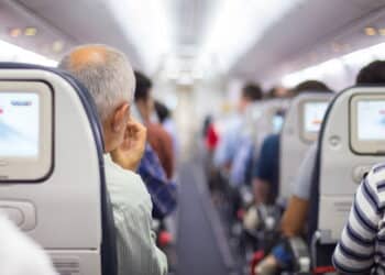 Interior of airplane with passengers on seats waiting to taik off.
