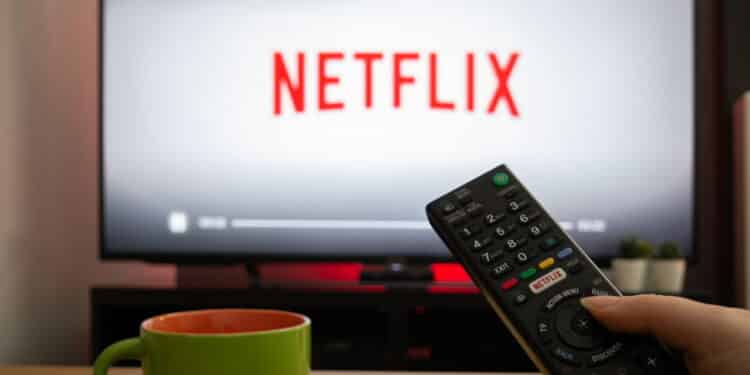 UK, March 2020: TV Television white netflix background with remote control