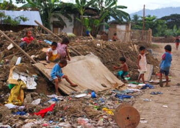 This street children in Asia makes the dumping area as their play ground