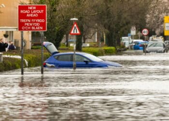 NANTGARW, NEAR CARDIFF, WALES - FEBRUARY 2020: Flood water on Treforest Industrial Estate as it enters the village of Nantgarw, near Cardiff