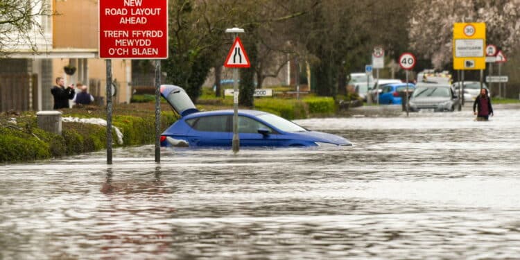 NANTGARW, NEAR CARDIFF, WALES - FEBRUARY 2020: Flood water on Treforest Industrial Estate as it enters the village of Nantgarw, near Cardiff