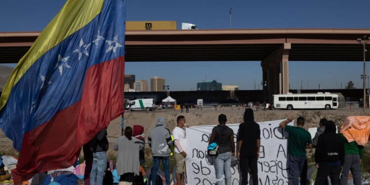 Juarez, Mexico, 10-24-2022: Venezuelan migrants protest at the border to request the termination of title 42, a law that allows migrants to be expelled immediately