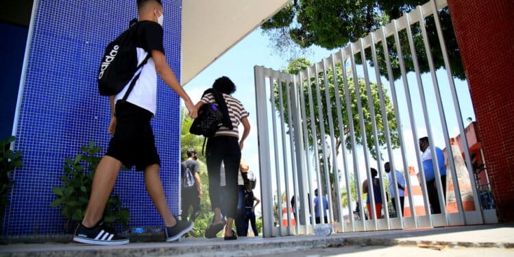 salvador, bahia, brazil - january 17, 2021: Candidates for the National High School Examination exam - Enem, are seen entering the gate of the State University of Bahia - Uneb, to take the exam in the city of Salvador.