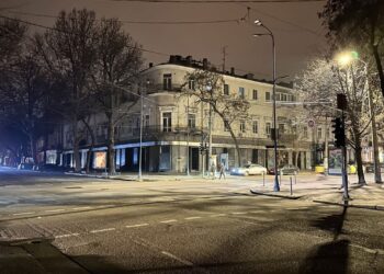 Odessa, Ukraine - 26 January 2023: Blackout in the Odessa Ukraine streets without street lighting only reflection color of traffic light and cars lights.