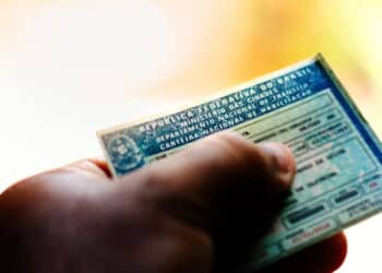 April 5, 2019, Brazil. Man holds National Driver's License (CNH). Official document of Brazil, which attests the ability of a citizen to drive land vehicles.