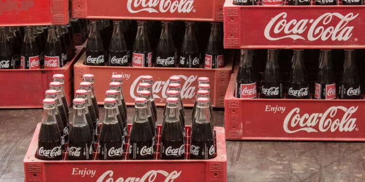 Phnom Penh, Cambodia- January 02,3024: Coca Cola bottles in red plastic box, vintage style. Coca cola is probably the worlds most famous brand.