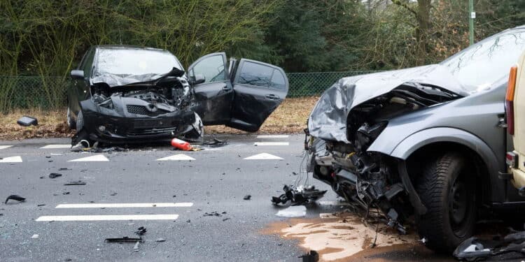 Two cars who crashed into another car on a interstate road