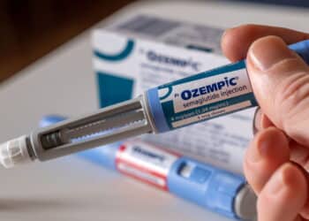 Montreal, CA - 25 November 2023: Hand holding Ozempic semaglutide injection pen. Ozempic is a medication for obesity