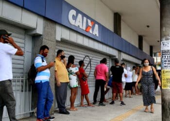 salvador, bahia, brazil - december 14, 2020: people are seen in line at Caixa Economica Federal, in downtown Salvador. *** Local Caption ***