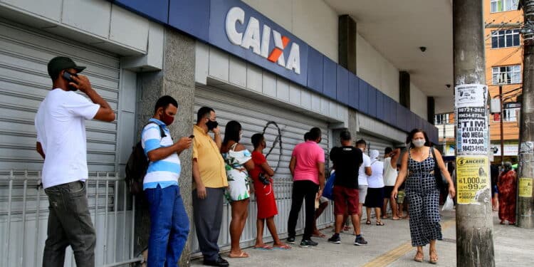 salvador, bahia, brazil - december 14, 2020: people are seen in line at Caixa Economica Federal, in downtown Salvador. *** Local Caption ***