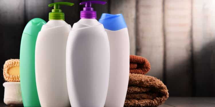 Plastic bottles of body care and beauty products.