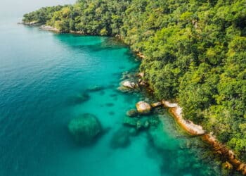 Big island Ilha Grande Abraao beach in Angra dos Reis, Rio de Janeiro, Brazil . High quality photo San Antonio Beach Praia San Antonio Lopes Mendes Beach in Background.