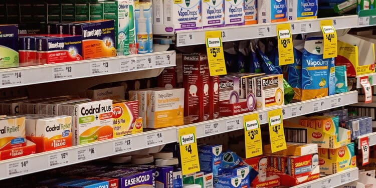 Walkerston, Queensland, Australia - February 2020: Cold and flu medicines and supplies on the shelves of Woolworths supermarket