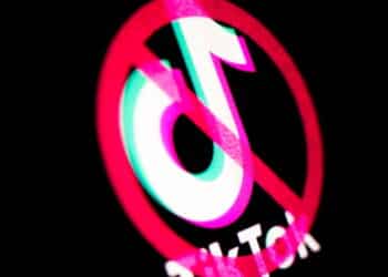 Kyiv, Ukraine -  March 9, 2021: TikTok banned. Logo on the screen. Various governmental agencies and private businesses have imposed bans on the social media service TikTok.