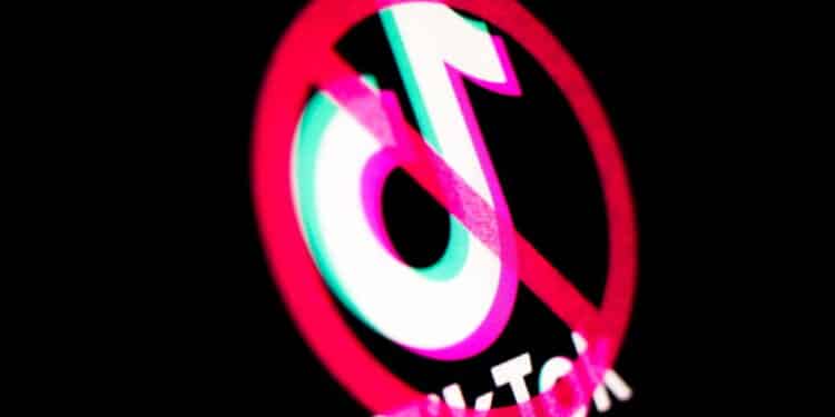 Kyiv, Ukraine -  March 9, 2021: TikTok banned. Logo on the screen. Various governmental agencies and private businesses have imposed bans on the social media service TikTok.