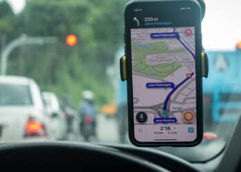 An iPhone X with Waze navigation app inside the car. Waze has gain popularity for its good navigation.