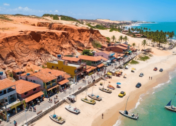 Uma vila pouco conhecida no Nordeste atrai turistas e investidores com falésias vermelhas e ventos ideais para energia limpa