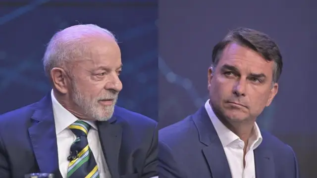 O presidente Luiz Inácio Lula da Silva e o senador Flávio Bolsonaro, durante debate da Band no domingo, 18 (TV Band/Divulgação)